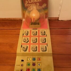 Vintage “I took a lickin from a chicken’” game